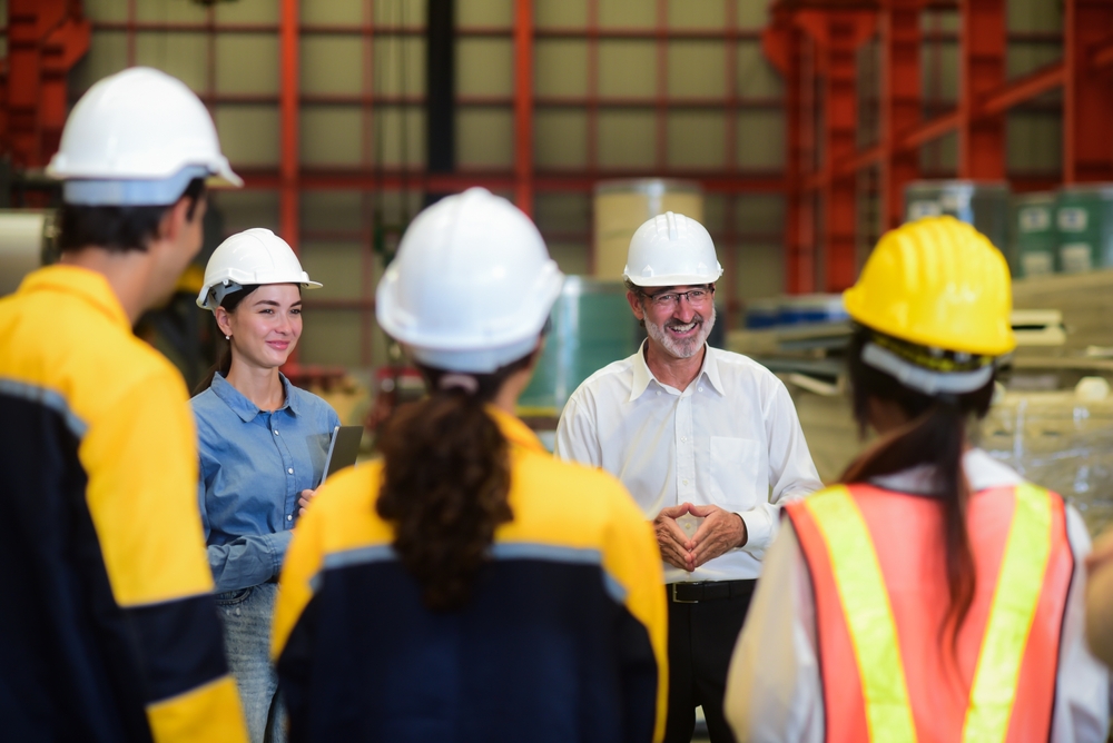 Group Portrait Of Industry Workers In Factory