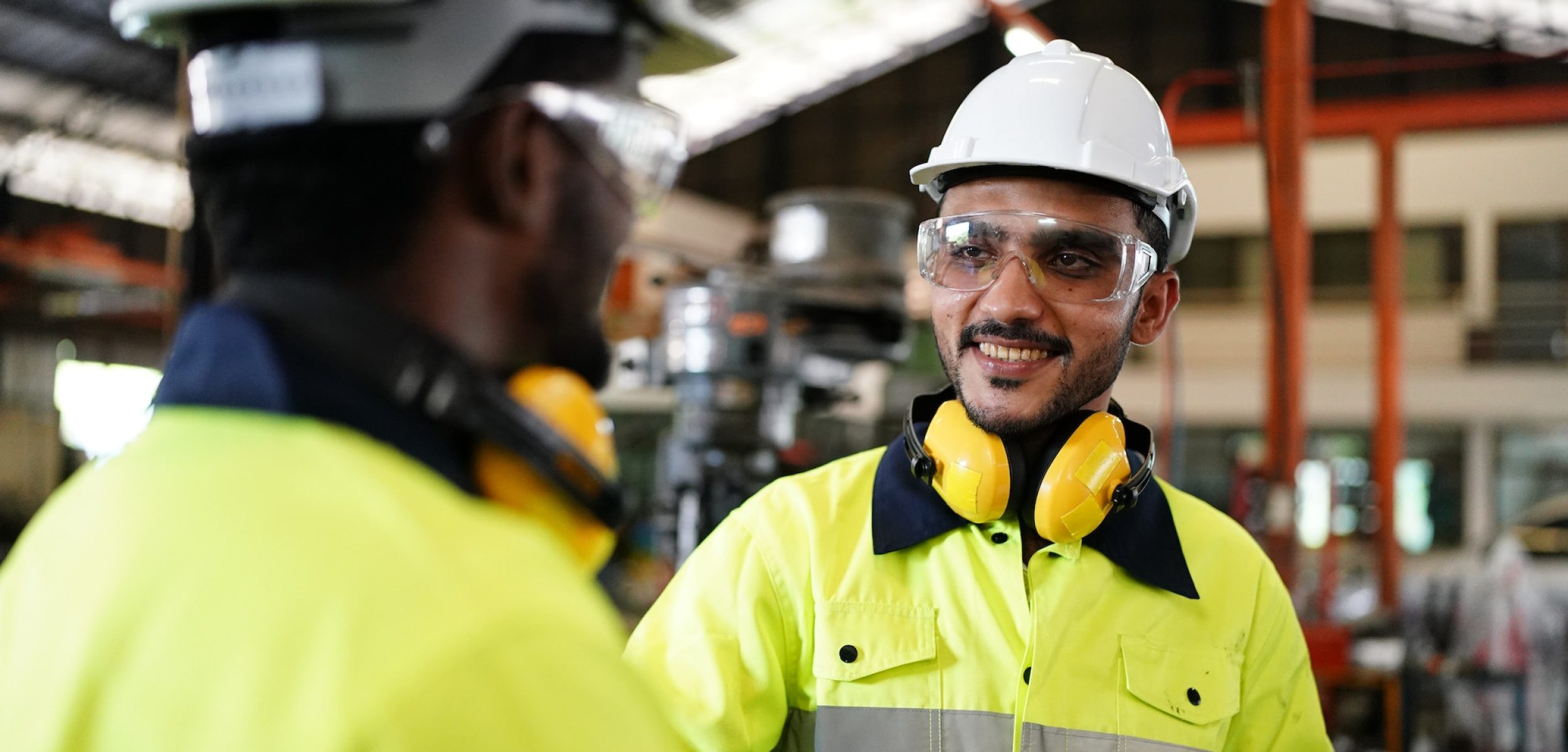 industrial factory worker working in metal manufacturing industry