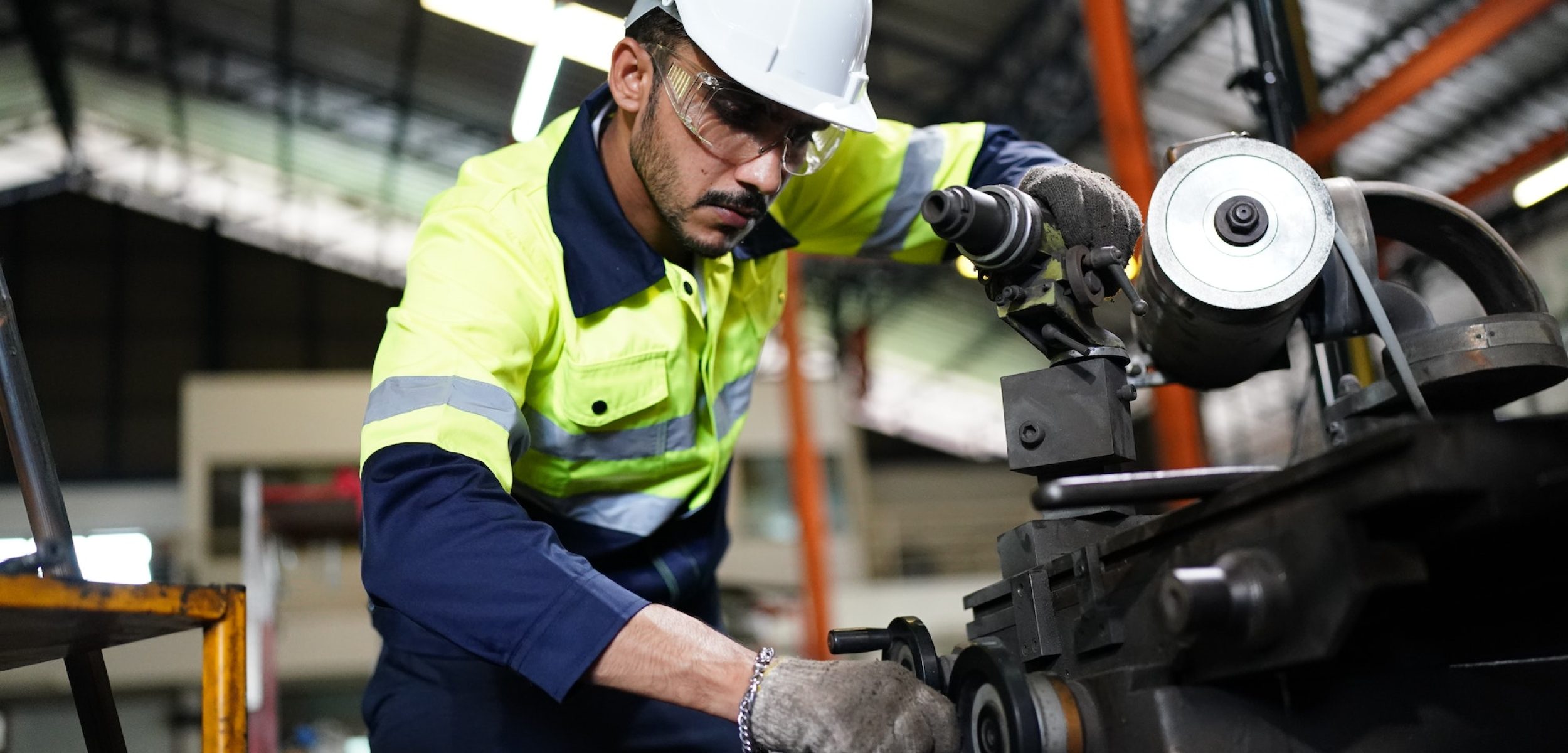 industrial factory worker working in metal manufacturing industry