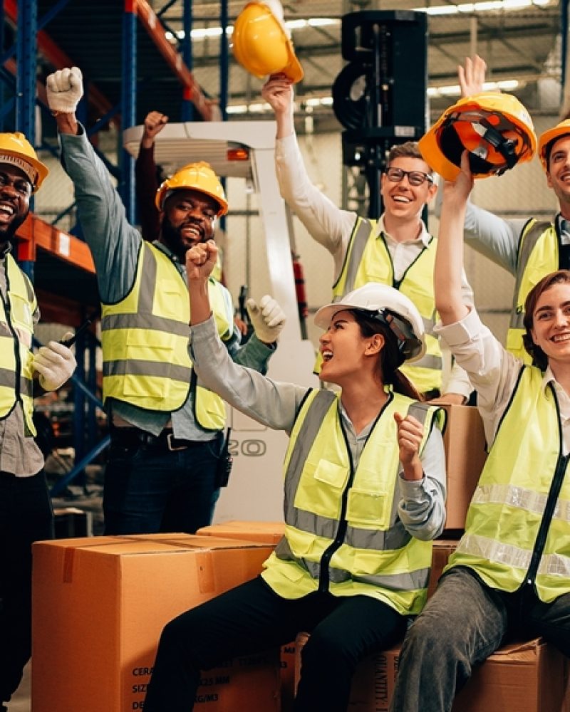 Professional Warehouse Worker Team Celebrating Success In Warehouse Factory